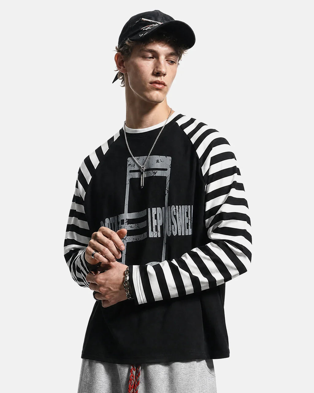Inflation Streetwear music graphic striped long sleeve T-shirt featuring bold musical notes and colorful stripes on a black background.