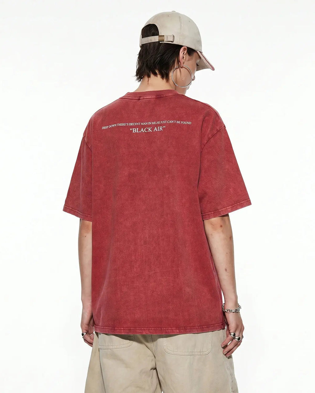 Oversized washed graphic T-shirt by INFLATION featuring bold streetwear design and relaxed fit, displayed on a hanger.