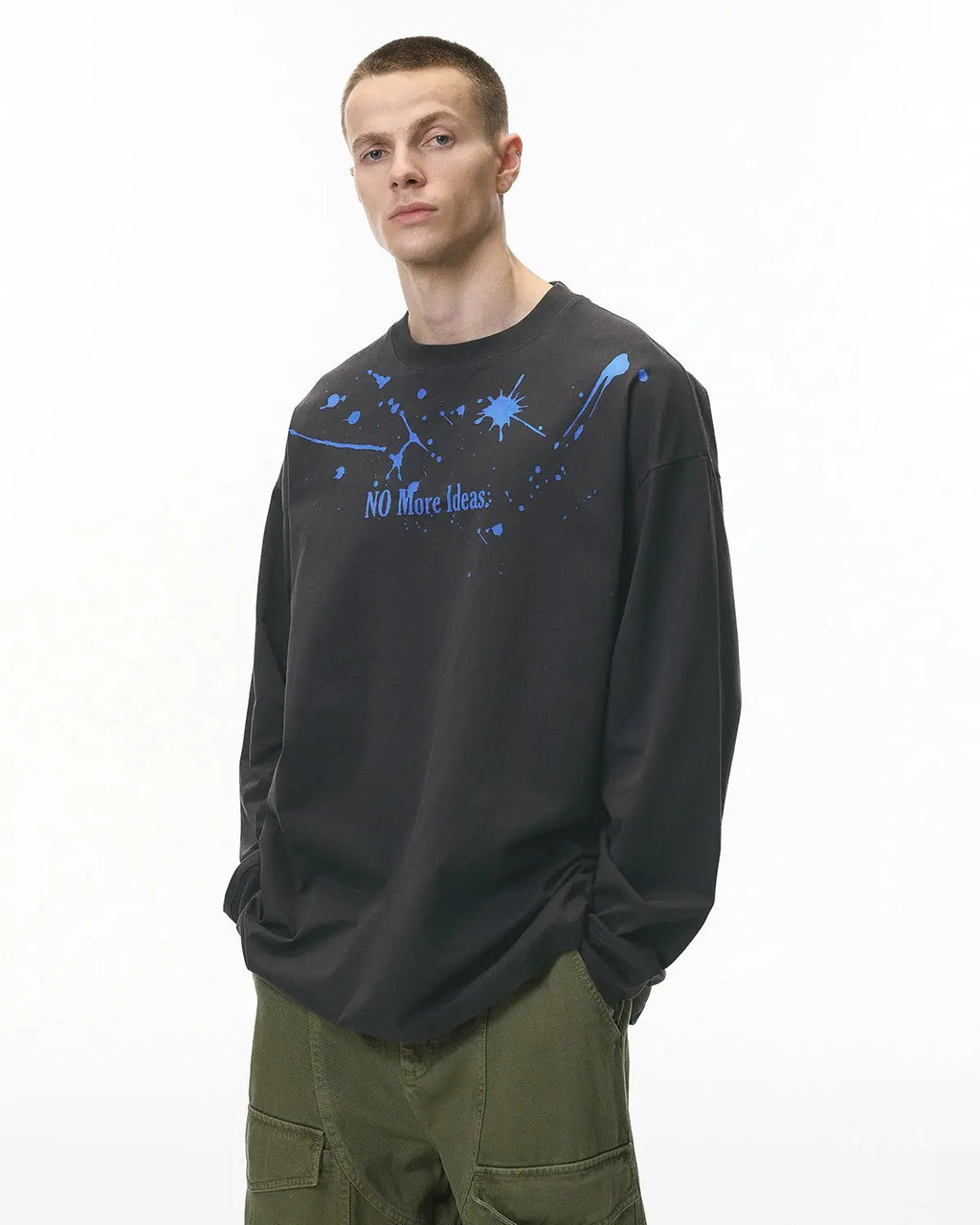Laser burning streetwear tee by Flation featuring bold, graphic laser design on black cotton fabric.