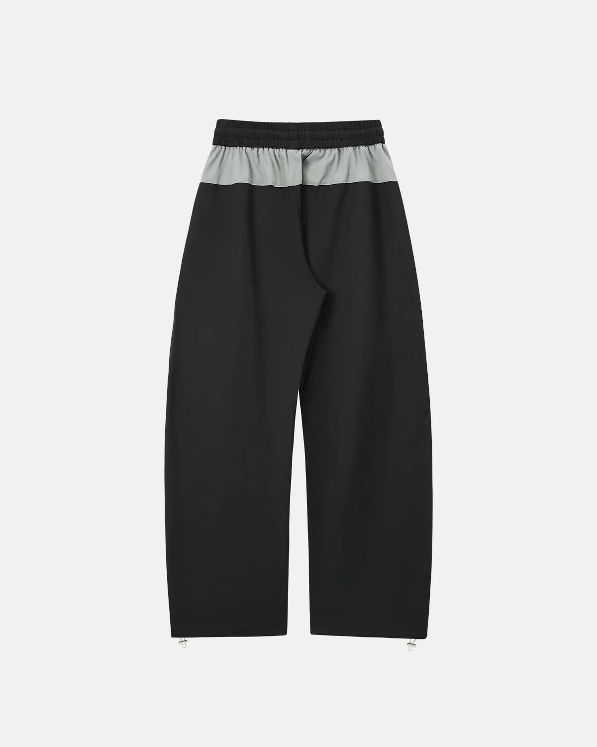 Reflective windbreaker track pants by Flation Streetwear, featuring a sleek design with reflective accents and comfortable fit.