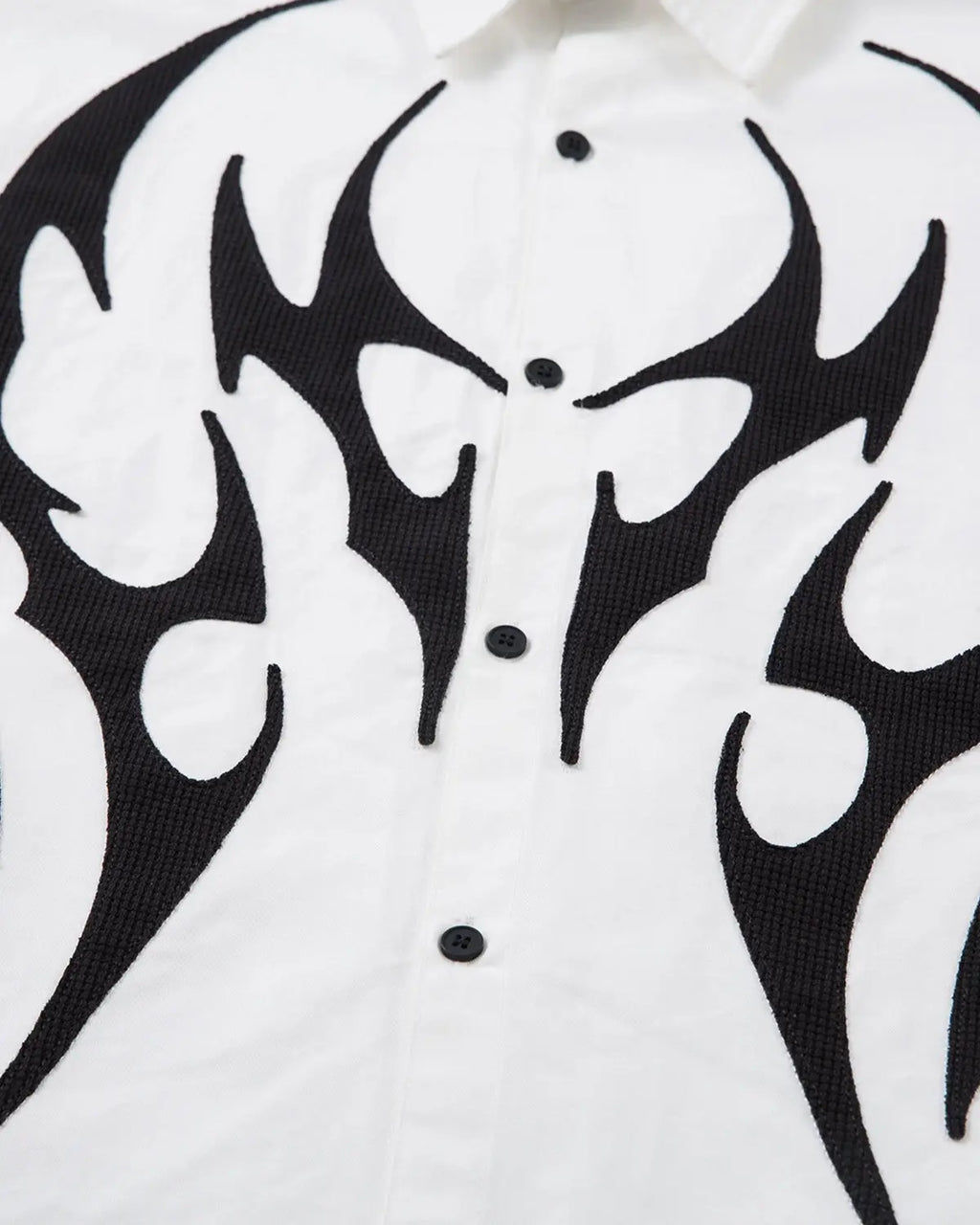 Inflation Streetwear layered tribal graphic T-shirt featuring bold tribal patterns on a casual streetwear shirt.