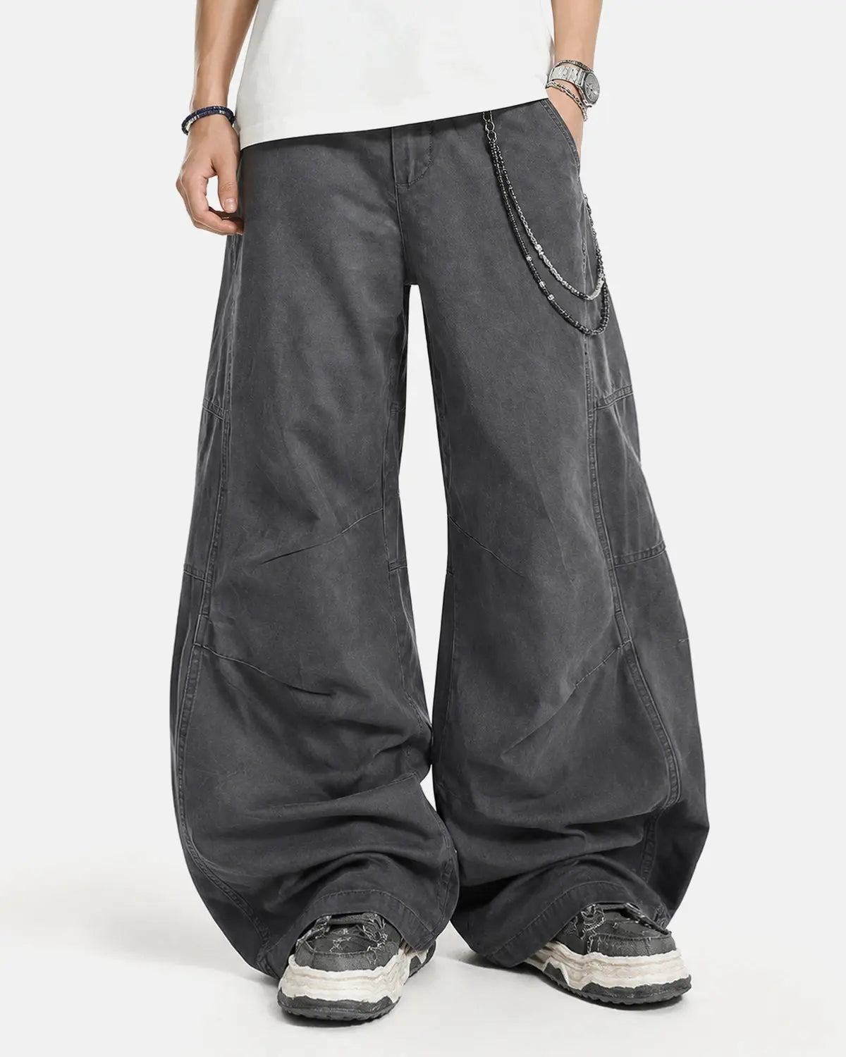 Washed curved seam cargo pants by INFLATION, featuring a relaxed fit, multiple pockets, and curved seam details.