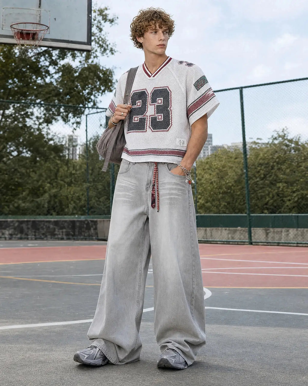 Washed distressed baggy jeans from Flation Streetwear featuring a relaxed fit and faded, ripped denim design.