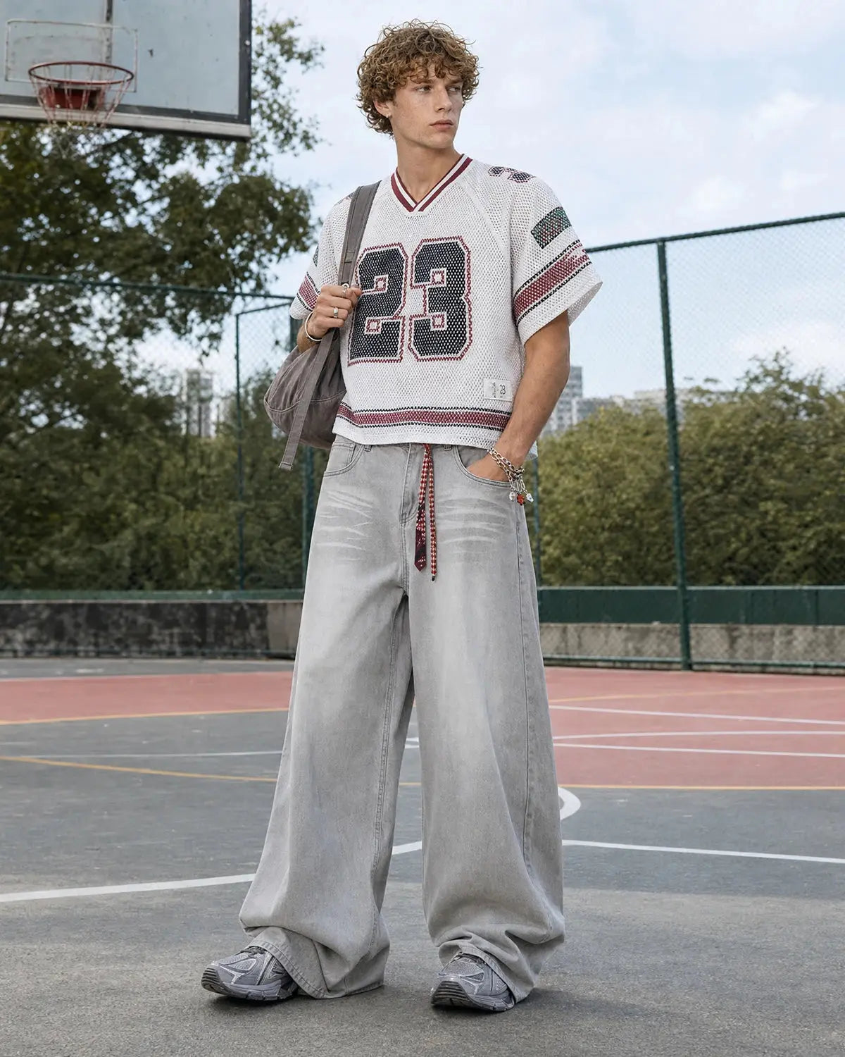 Washed distressed baggy jeans from Flation Streetwear featuring a relaxed fit and faded, ripped denim design.