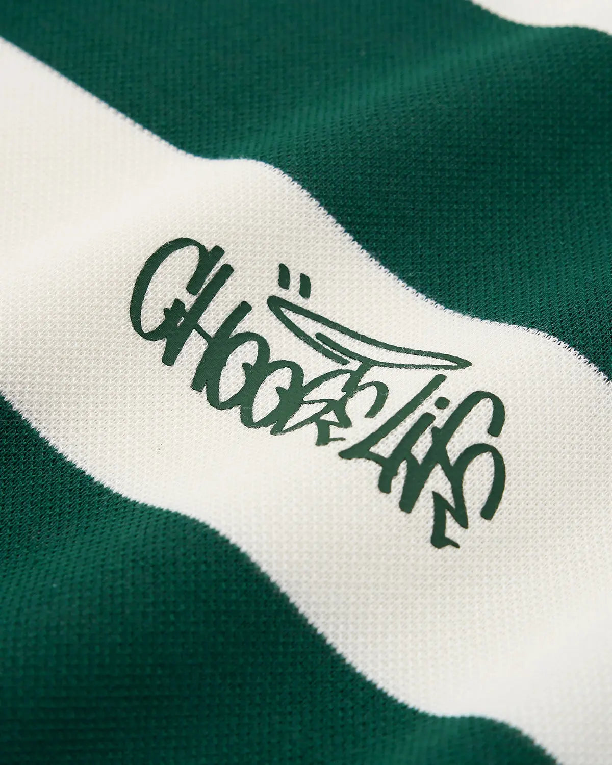 Green Flation Streetwear rugby polo shirt, casual t-shirt with collar and short sleeves, displayed flat against a neutral background.