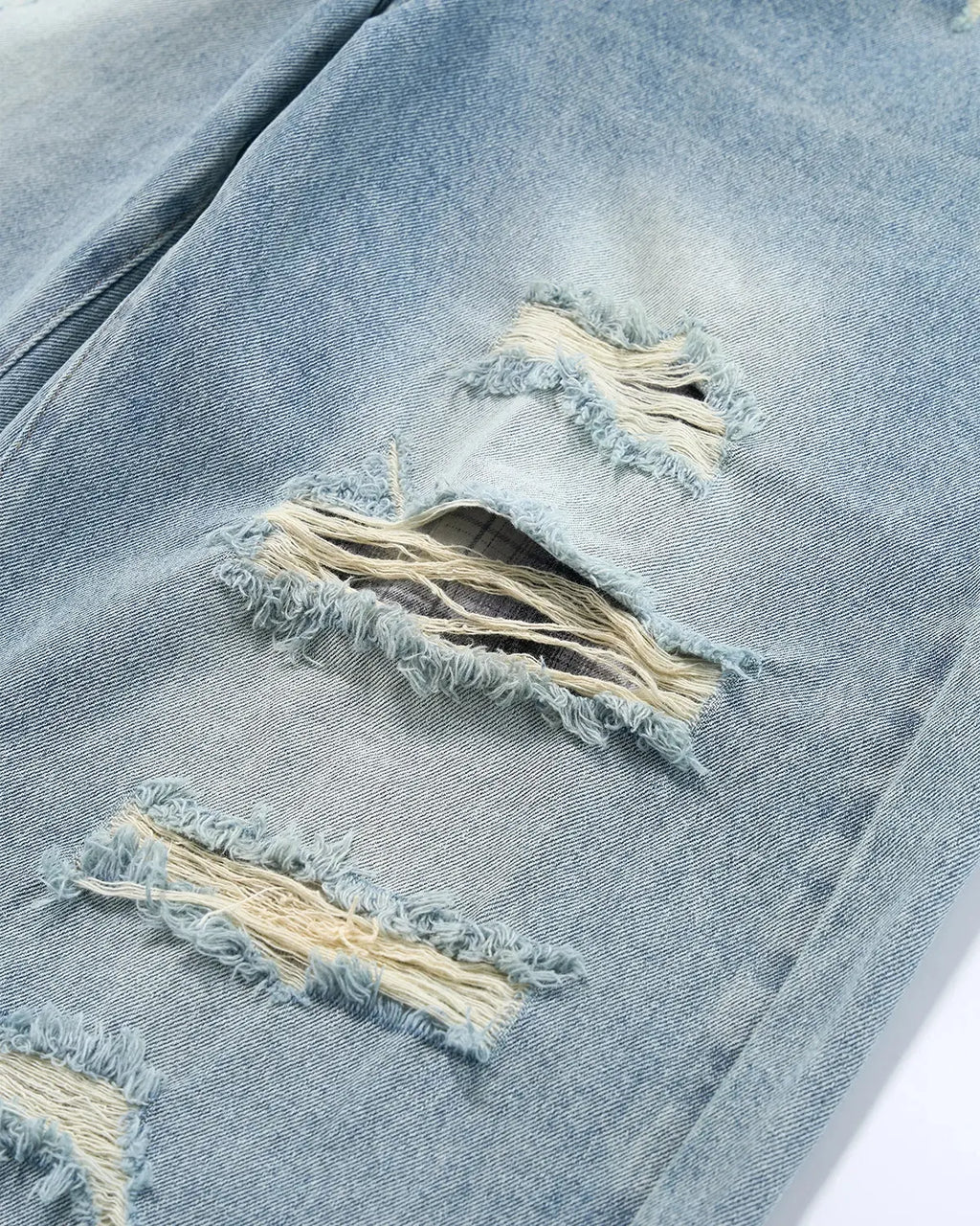 Vintage wash distressed baggy jeans by INFLATION Streetwear, featuring faded denim and relaxed fit with distressed details.