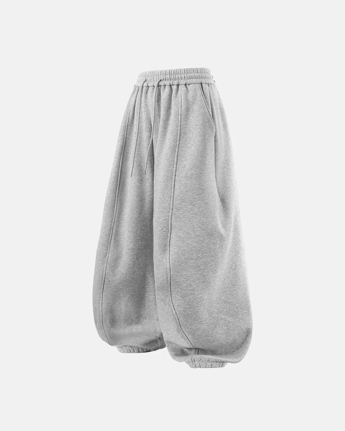Grey baggy jogger sweatpants by INFLATION Streetwear with relaxed fit and elastic waistband, shown on a model.