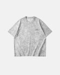 Inflation Streetwear distressed tie-dye reflective print T-shirt showing bold tie-dye pattern and reflective graphic design.