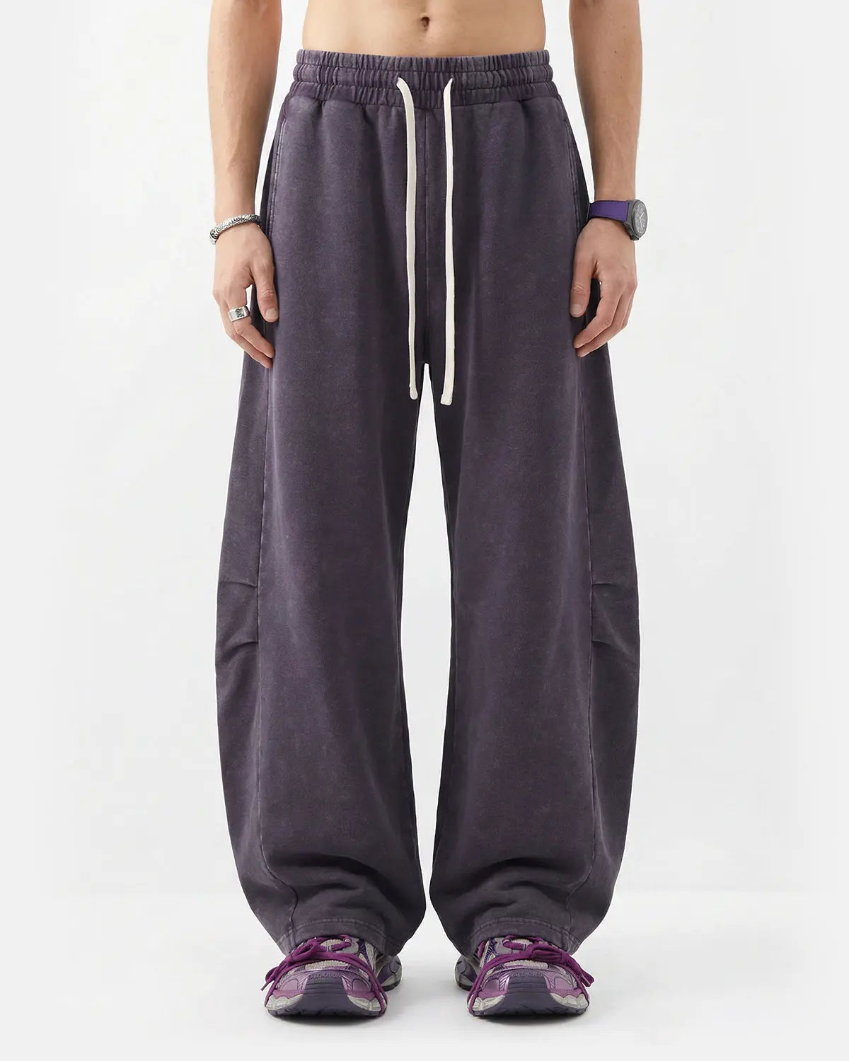 Distressed acid washed barrel sweatpants from Inflation Streetwear, featuring a relaxed fit and unique acid wash design.