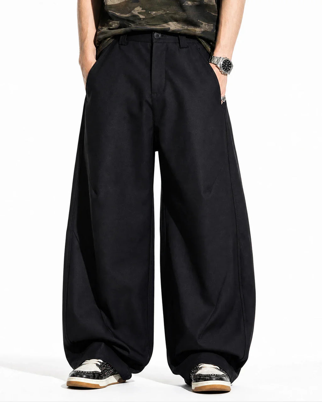 Flation Pleated Barrel Tailored Pants showing high-waisted design, pleats, and tapered leg fit in a streetwear style.