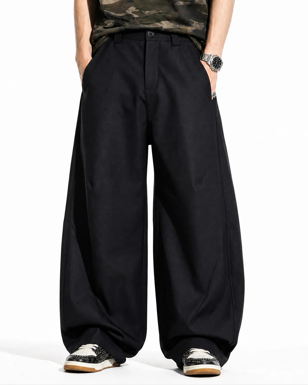 Flation Pleated Barrel Tailored Pants showing high-waisted design, pleats, and tapered leg fit in a streetwear style.