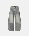 Distressed eyelet barrel jeans by INFLATION featuring a relaxed fit, frayed details, and eyelet accents for a trendy streetwear look.