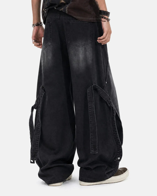 Inflation streetwear washed straight-leg jeans with adjustable straps, shown on a model, casual denim style with a relaxed fit.