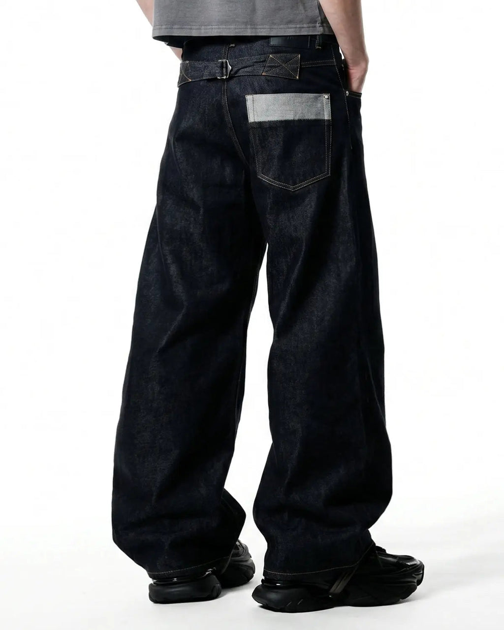 Raw baggy jeans with button fly from Inflation Streetwear, featuring a relaxed fit and distressed denim style.
