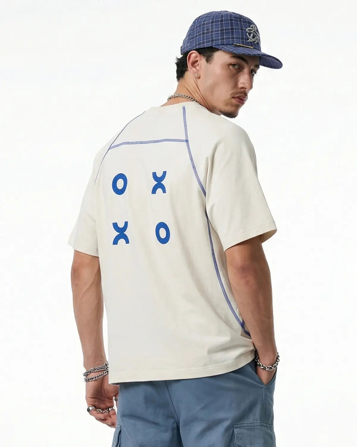 INFLATION activewear breathable breezy tee in lightweight fabric, shown on a model with a casual streetwear style.