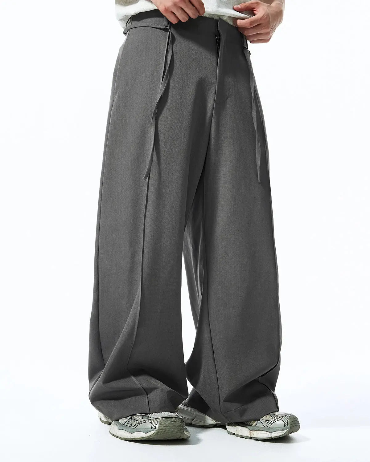 Flation Cleanfit Baggy Suit Pants with relaxed fit and pleated design, made from lightweight fabric, streetwear style.