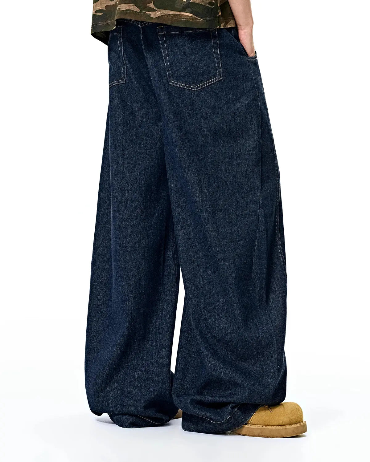 Raw washed barrel jeans by Flation Streetwear, showing the durable denim pants with a relaxed fit and faded finish.