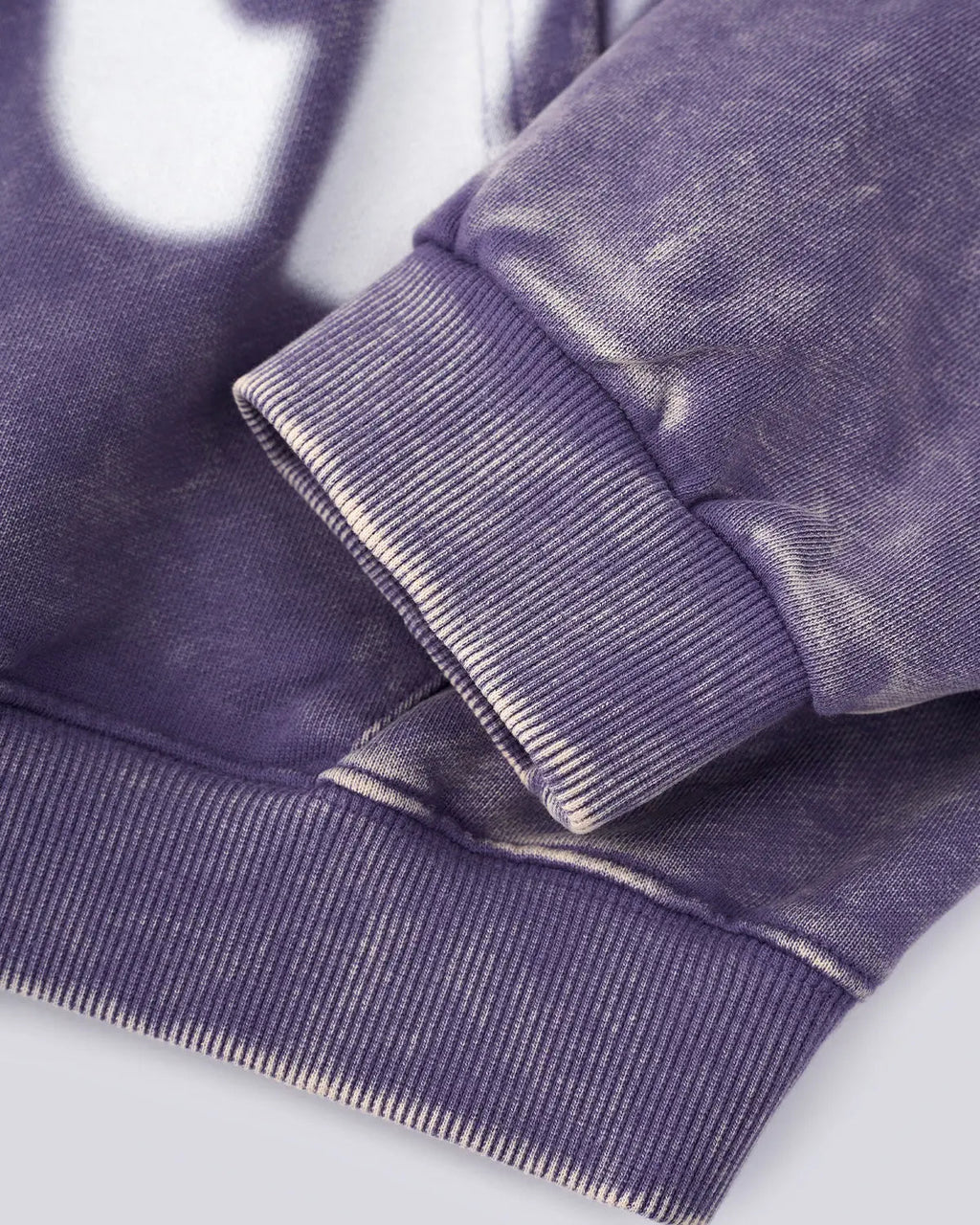 Acid washed "Peace" hoodie by INFLATION featuring a relaxed fit and streetwear style, shown in a close-up of the fabric details.