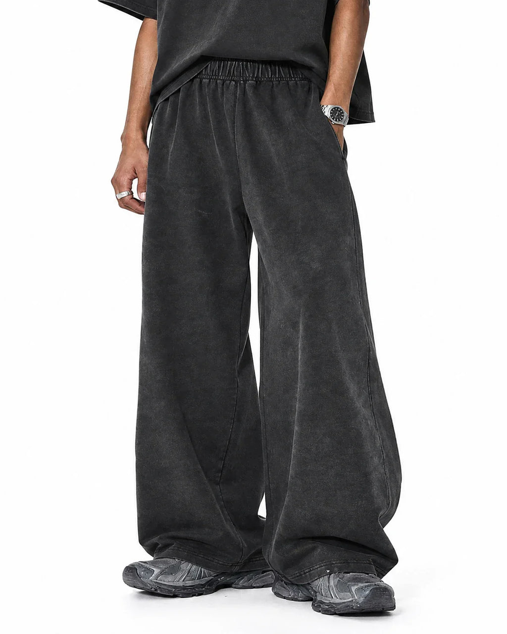 Washed graphic wide-leg sweatpants by INFLATION Streetwear featuring relaxed fit and bold graphic design, shown on a model.