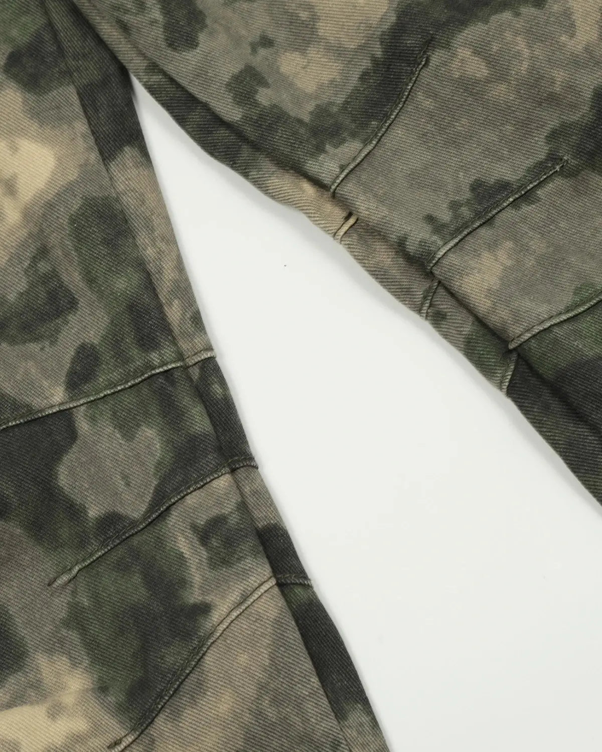 Camo multi-pocket baggy cargo pants by INFLATION featuring a relaxed fit, multiple pockets, and streetwear style.