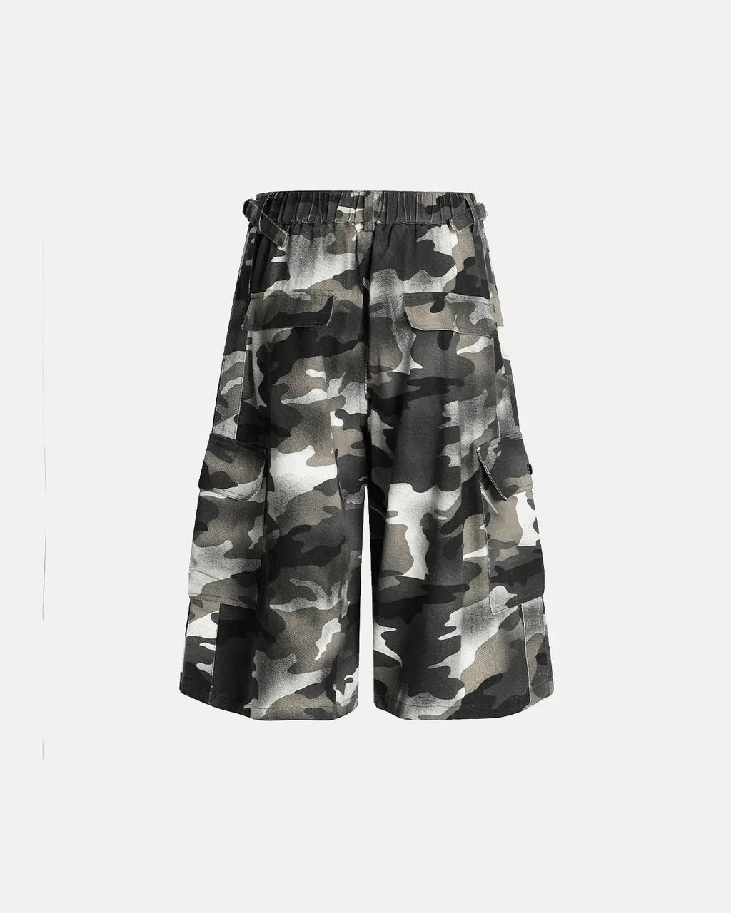 Grey camo utility longline shorts by INFLATION, featuring multiple pockets and a relaxed fit, displayed on a mannequin.