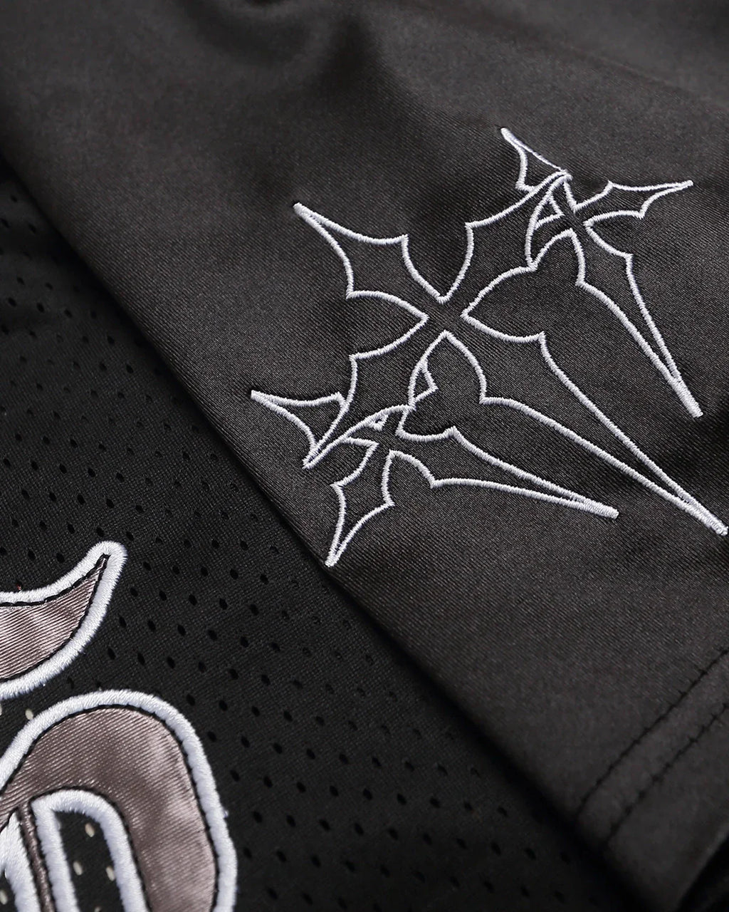 Gothic embroidered mesh jersey t-shirt by INFLATION with dark, intricate embroidery and see-through mesh fabric, streetwear style.