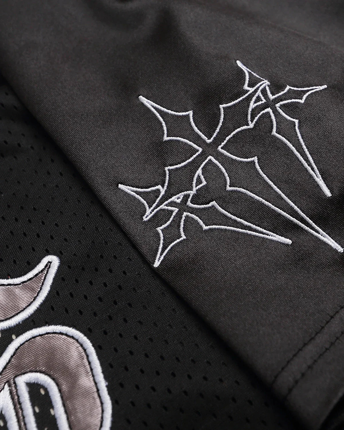 Gothic embroidered mesh jersey t-shirt by INFLATION with dark, intricate embroidery and see-through mesh fabric, streetwear style.