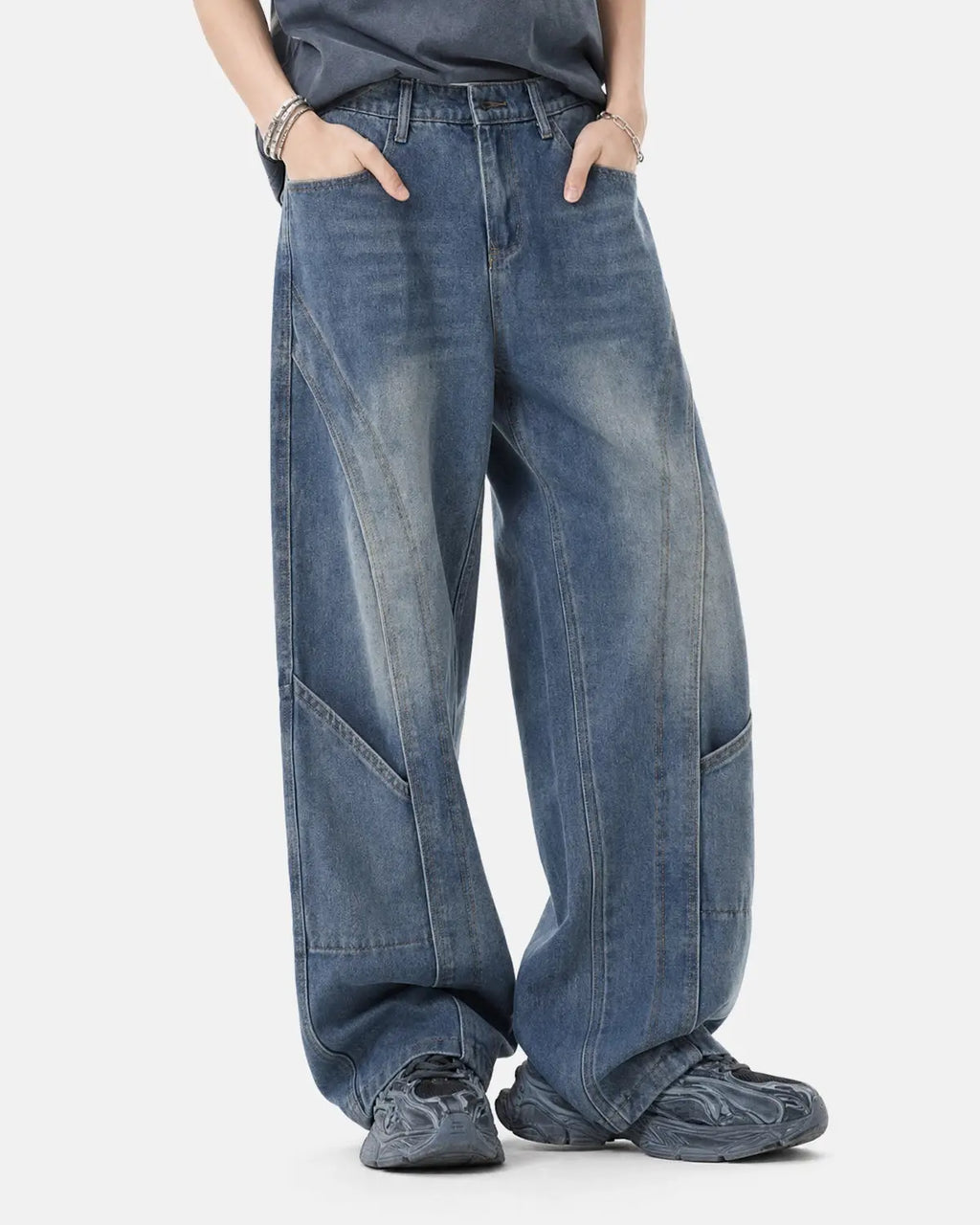 Deconstructed baggy straight-leg jeans from Inflation Streetwear with distressed details and relaxed fit, shown on a model.
