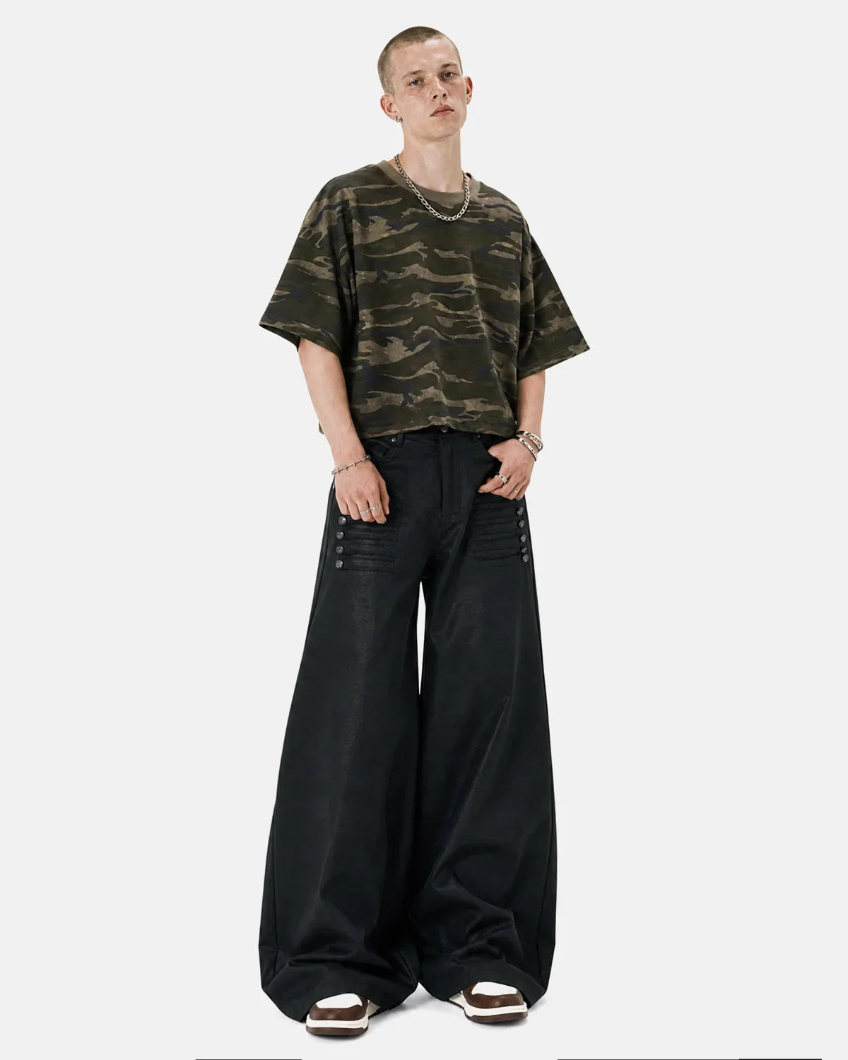 Black graphic wide leg pants by INFLATION featuring bold streetwear style and relaxed fit with wide legs and graphic details.