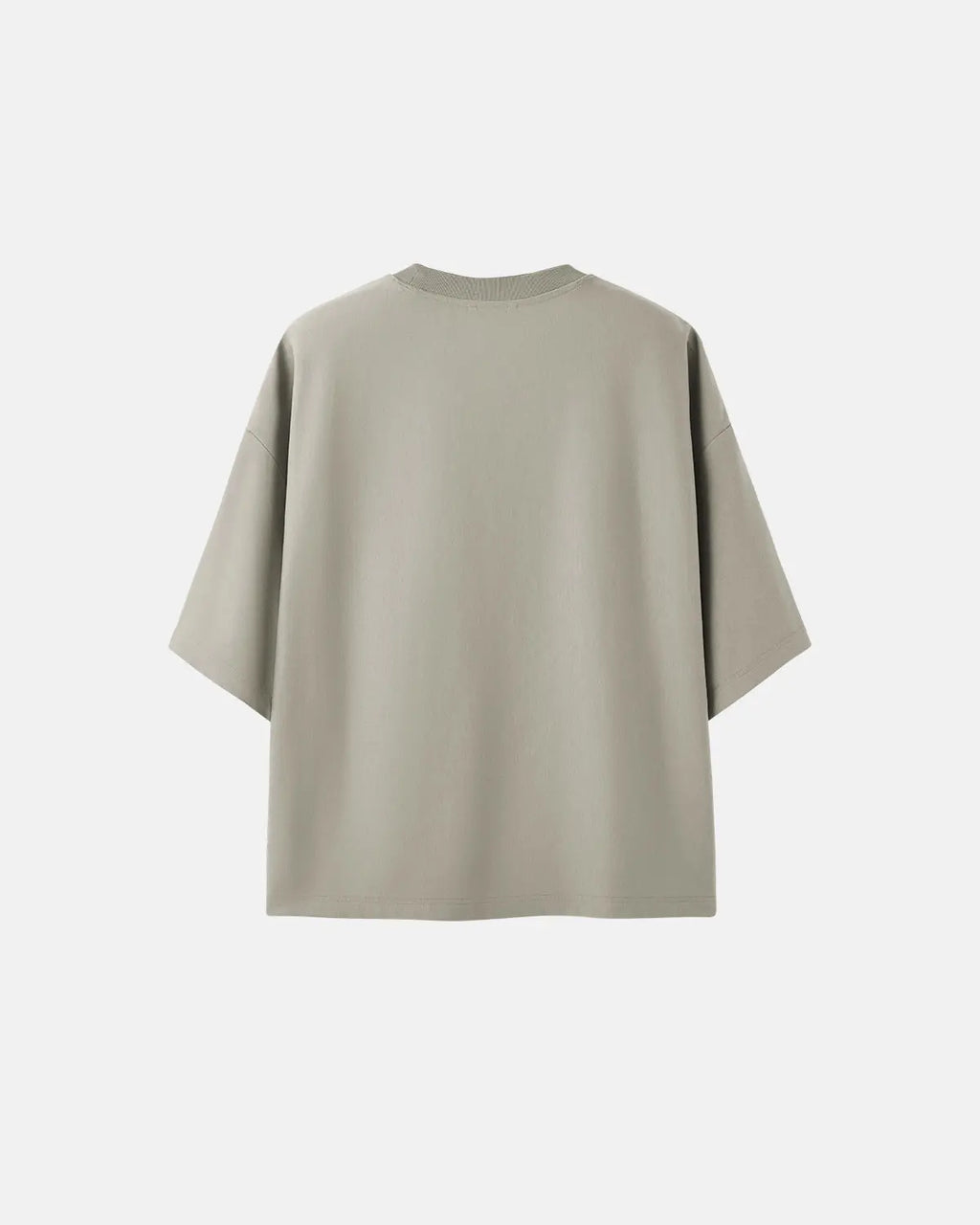 Blank oversized boxy T-shirt by Flation Streetwear, showing a relaxed fit in plain fabric on a neutral background.