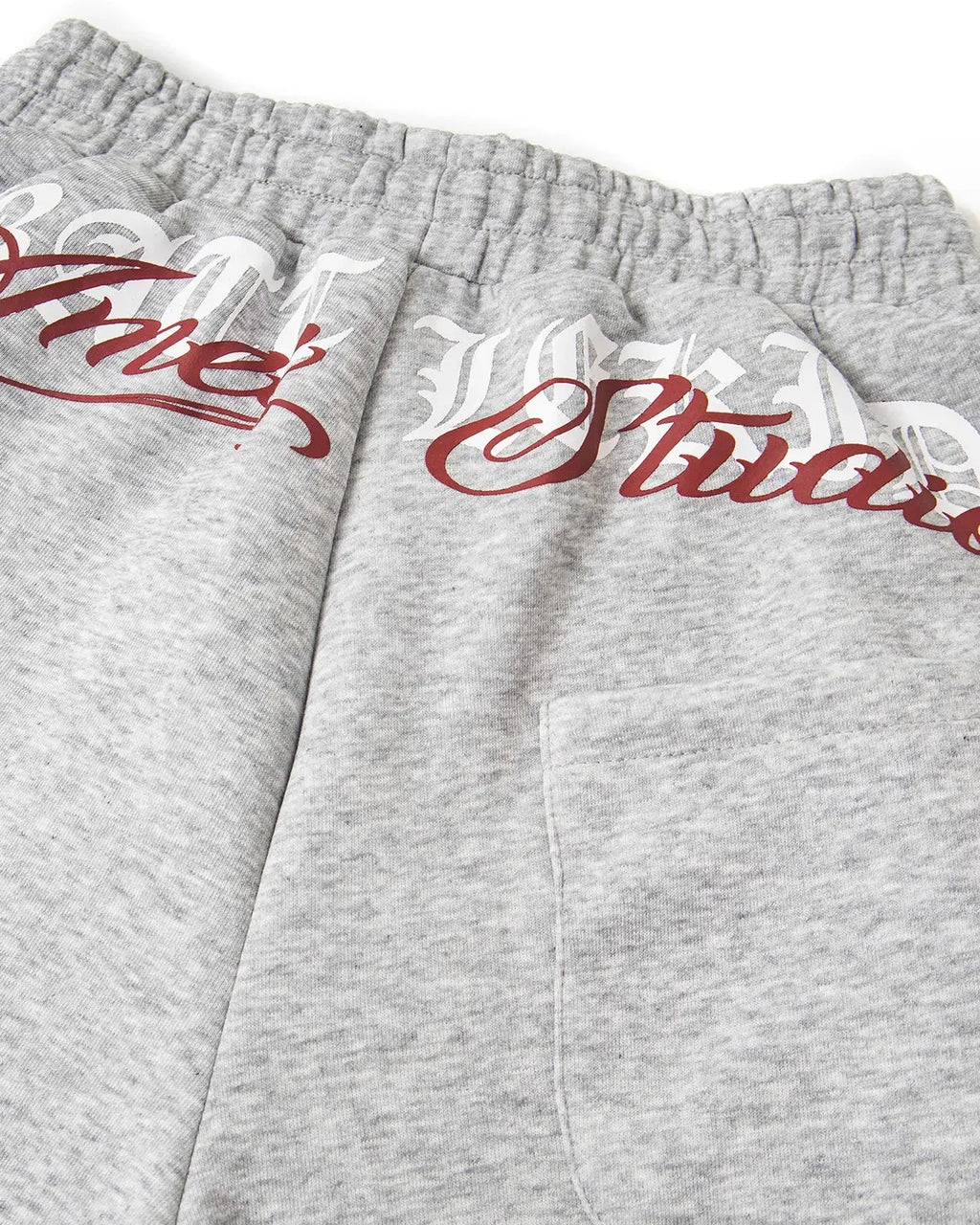 Inflation Cross Print Baggy Sweatpants in black with bold cross graphics, relaxed fit streetwear style.