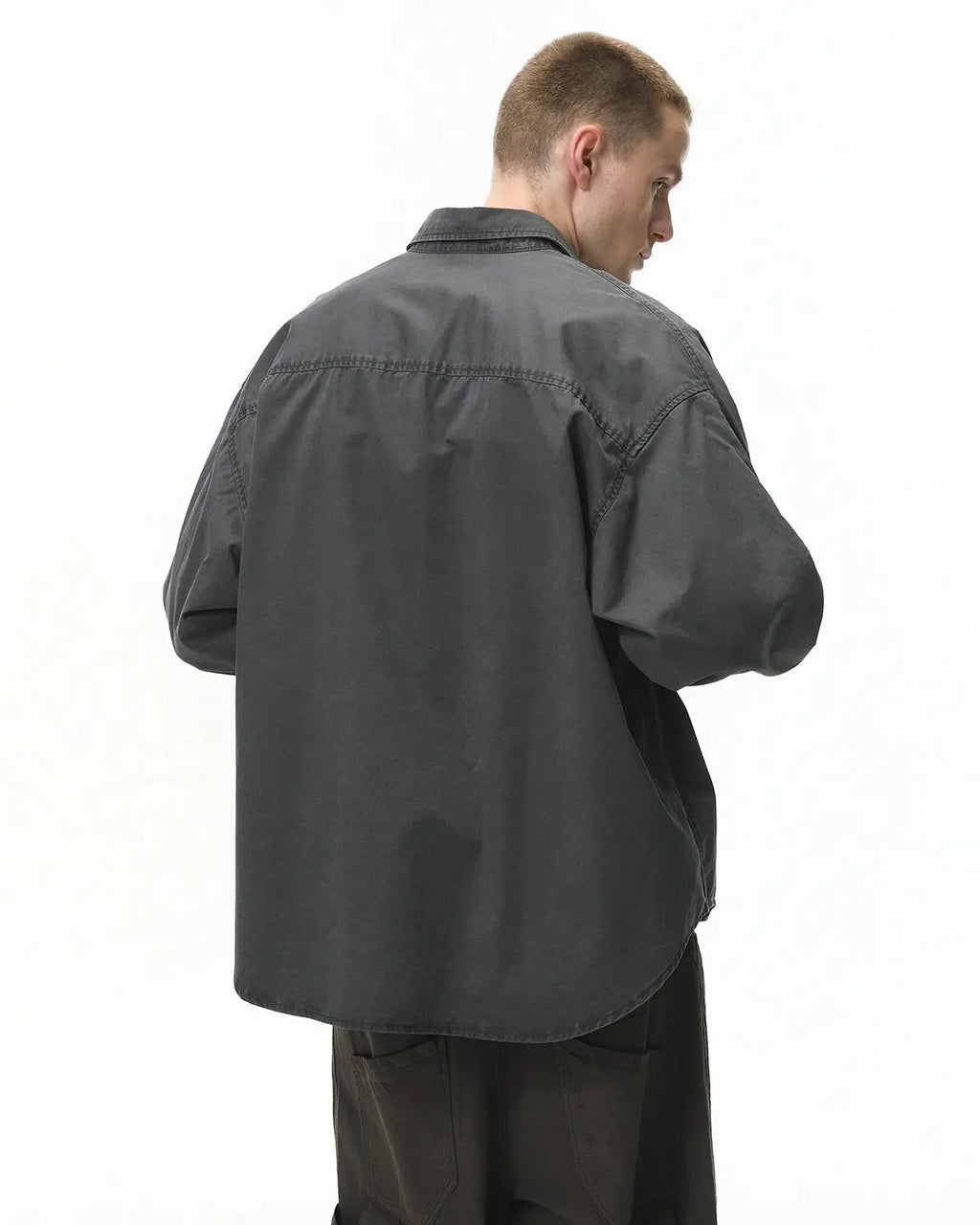 Acid wash cargo shirt jacket by Flation featuring multiple pockets and a relaxed streetwear style.