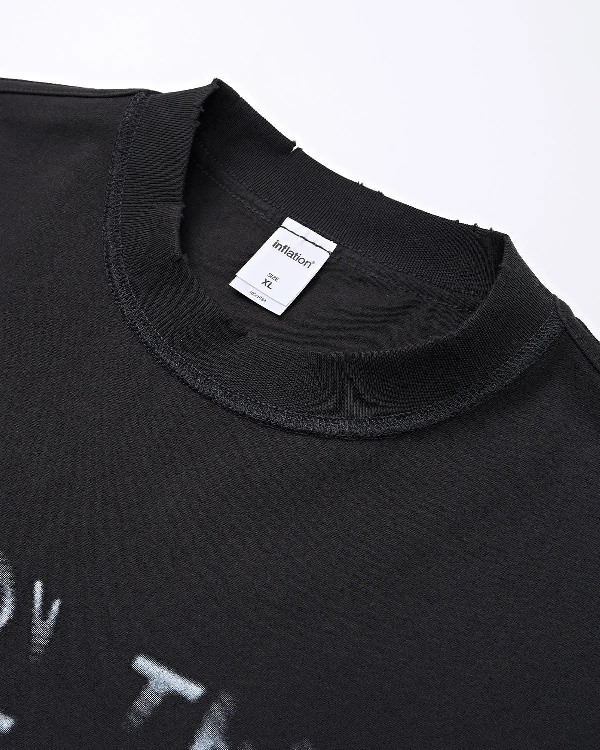 Vintage sticker graphic oversized T-shirt by INFLATION featuring bold, colorful retro-inspired streetwear design and relaxed fit.