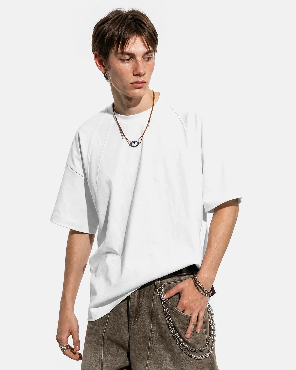 Boxy deconstructed T-shirt by INFLATION featuring a loose fit, minimalist design, and modern streetwear style.