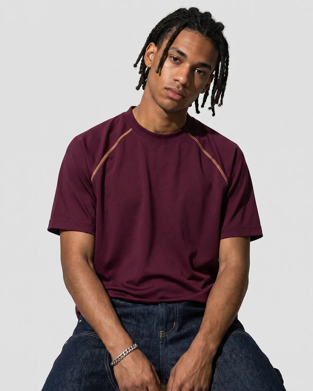 Inflation Streetwear contrast stitching stretch T-shirt featuring colorful stitch details and a fitted casual design.