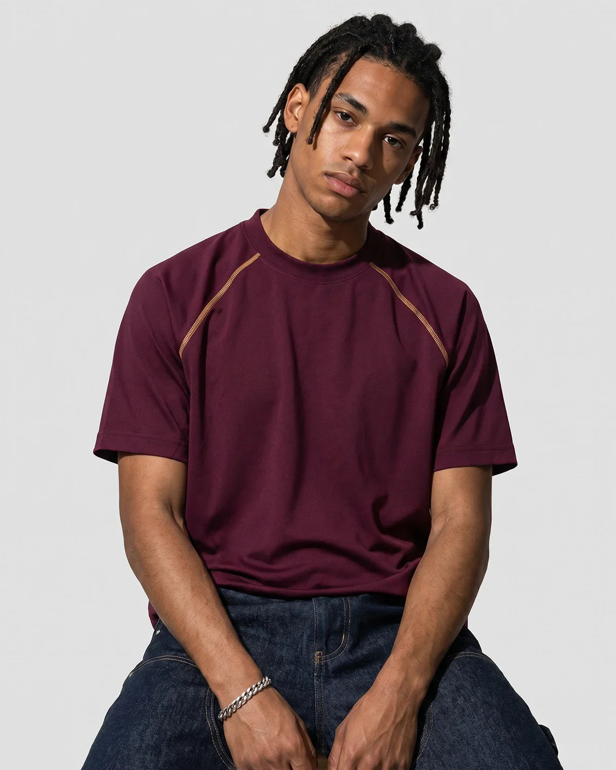 Inflation Streetwear contrast stitching stretch T-shirt featuring colorful stitch details and a fitted casual design.