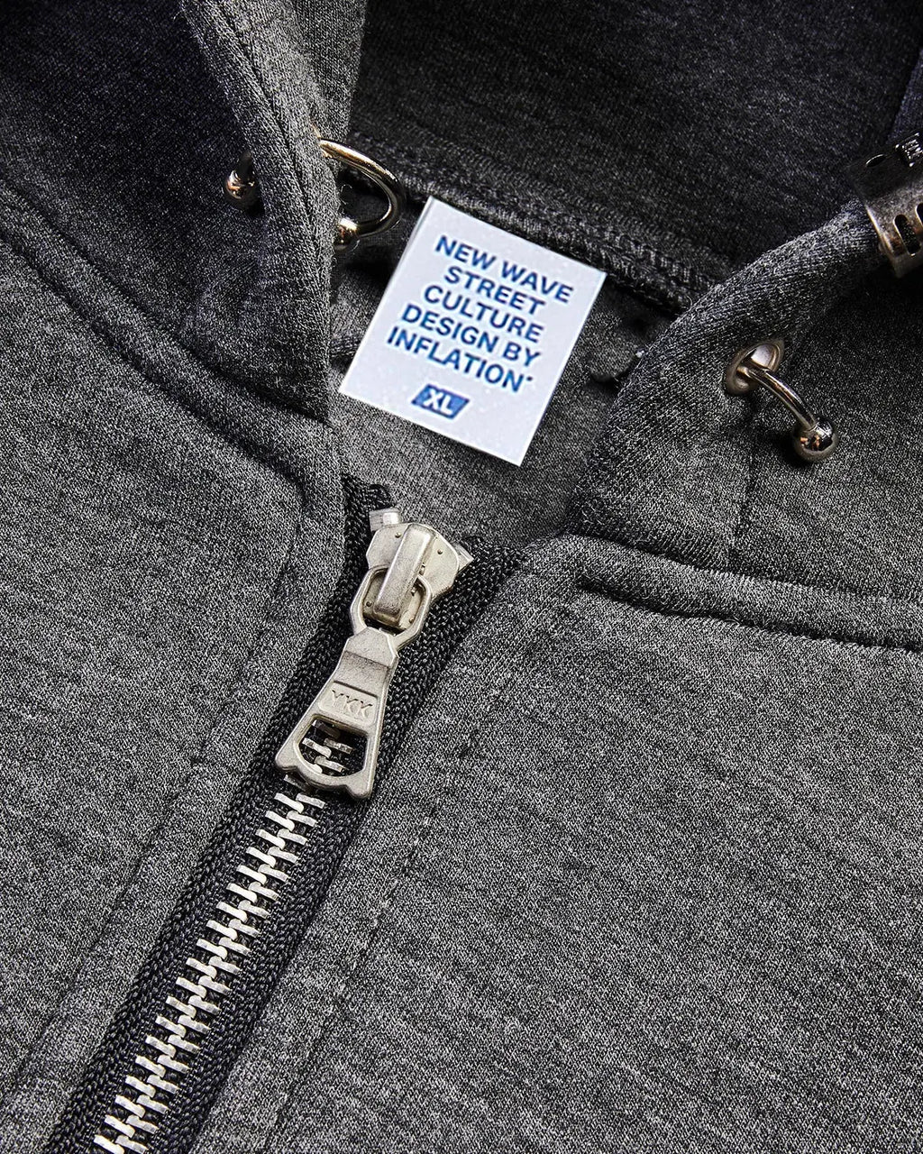 Gray Flation boxy zip-up hoodie with front pockets and a drawstring hood, displayed on a hanger.