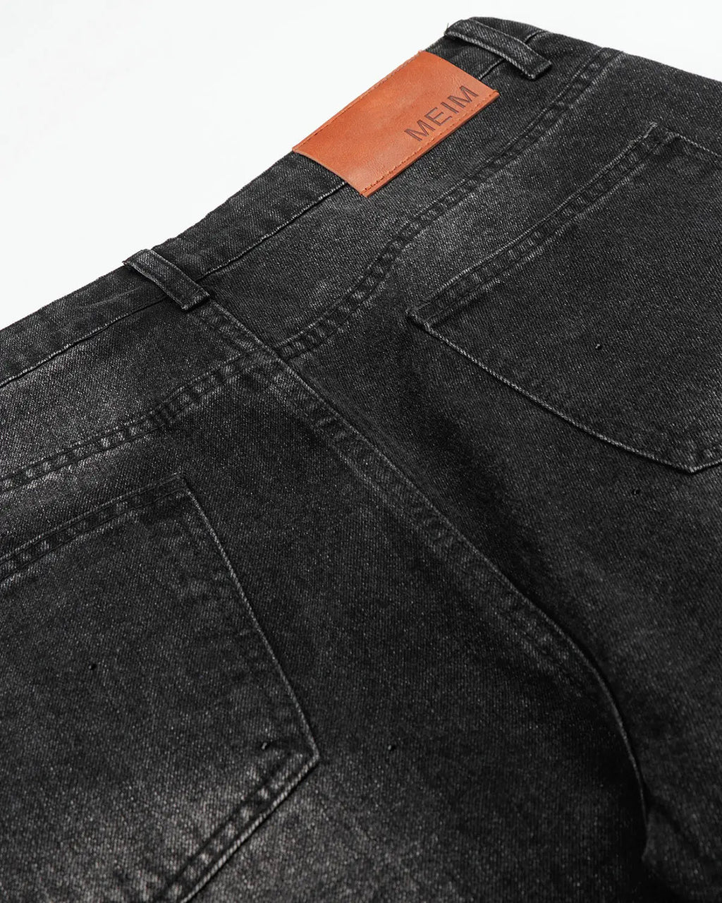 Vintage washed rhinestone barrel jeans by INFLATION, featuring distressed denim and embellishments, styled for streetwear fashion.
