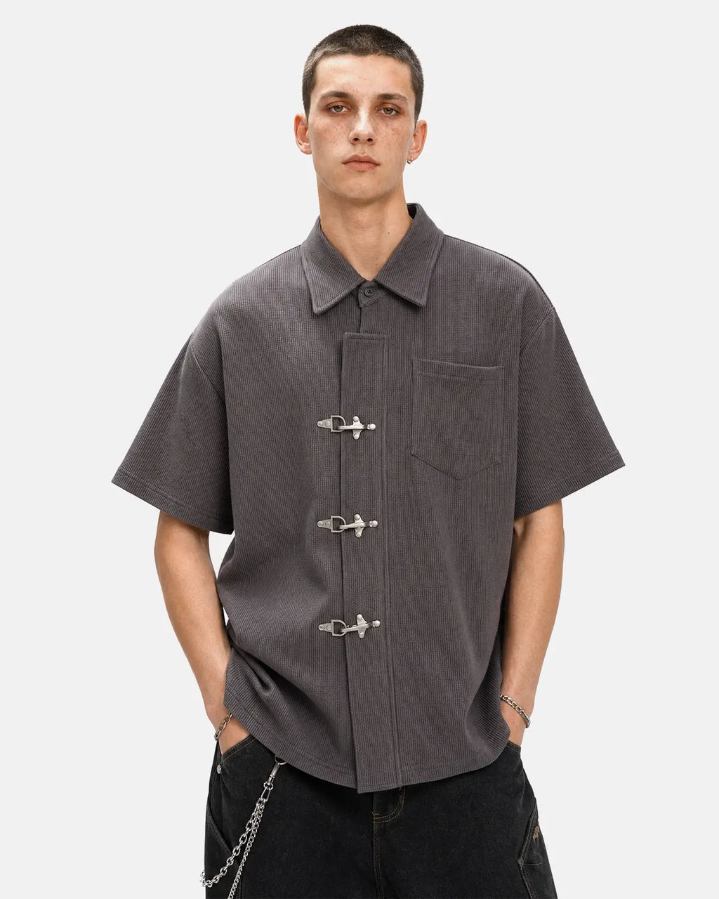 Metal clasp waffle shirt by INFLATION Streetwear featuring a textured fabric and distinctive metal clasp details.