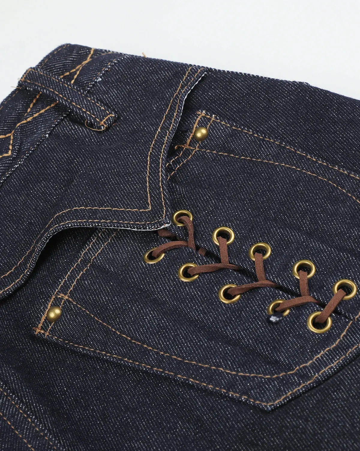 Inflation Streetwear side lace-up raw baggy jeans with distressed details and relaxed fit, showcasing casual streetwear style.