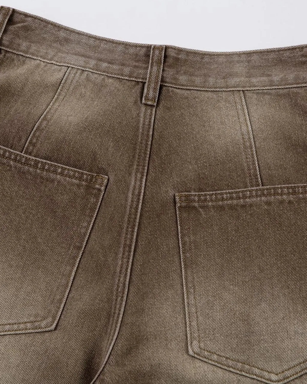 Brown acid wash barrel jeans by Flation featuring a relaxed fit, vintage-style wash, and classic five-pocket design.
