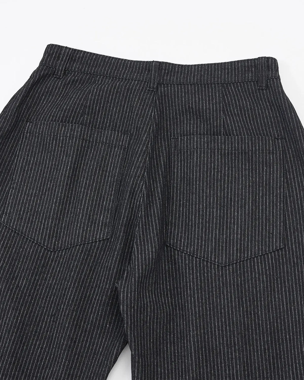 Vintage pinstripe pleated barrel jeans from INFLATION Streetwear, showcasing high-waisted design, pleats, and tapered leg fit.