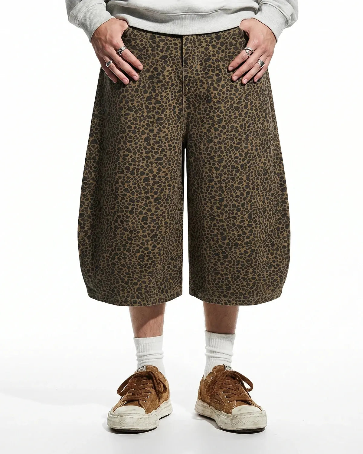 Leopard print barrel longline shorts by INFLATION, featuring a stylish longline design and bold animal print fabric.