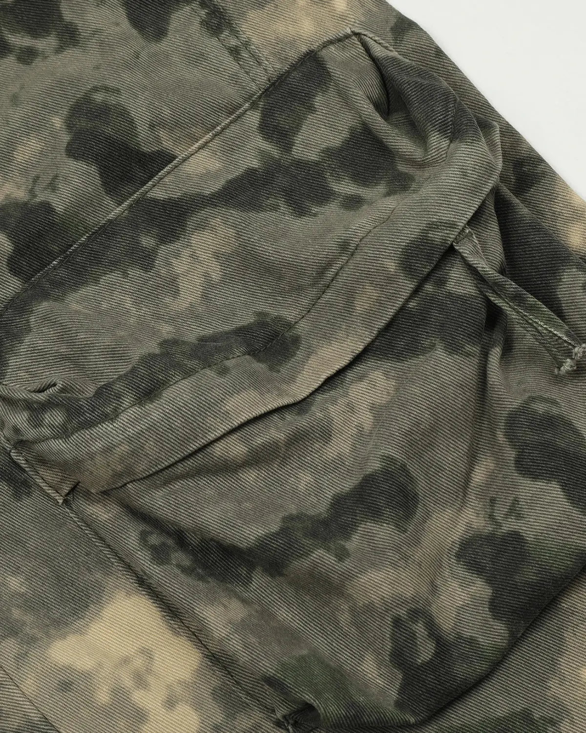 Camo multi-pocket baggy cargo pants by INFLATION featuring relaxed fit and multiple utility pockets on durable fabric.