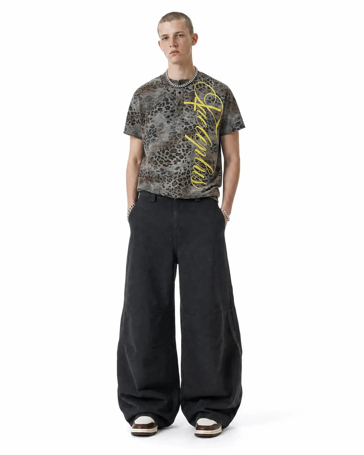 Leopard script Henley baby tee by INFLATION featuring a leopard print design and casual style on a soft fabric shirt.