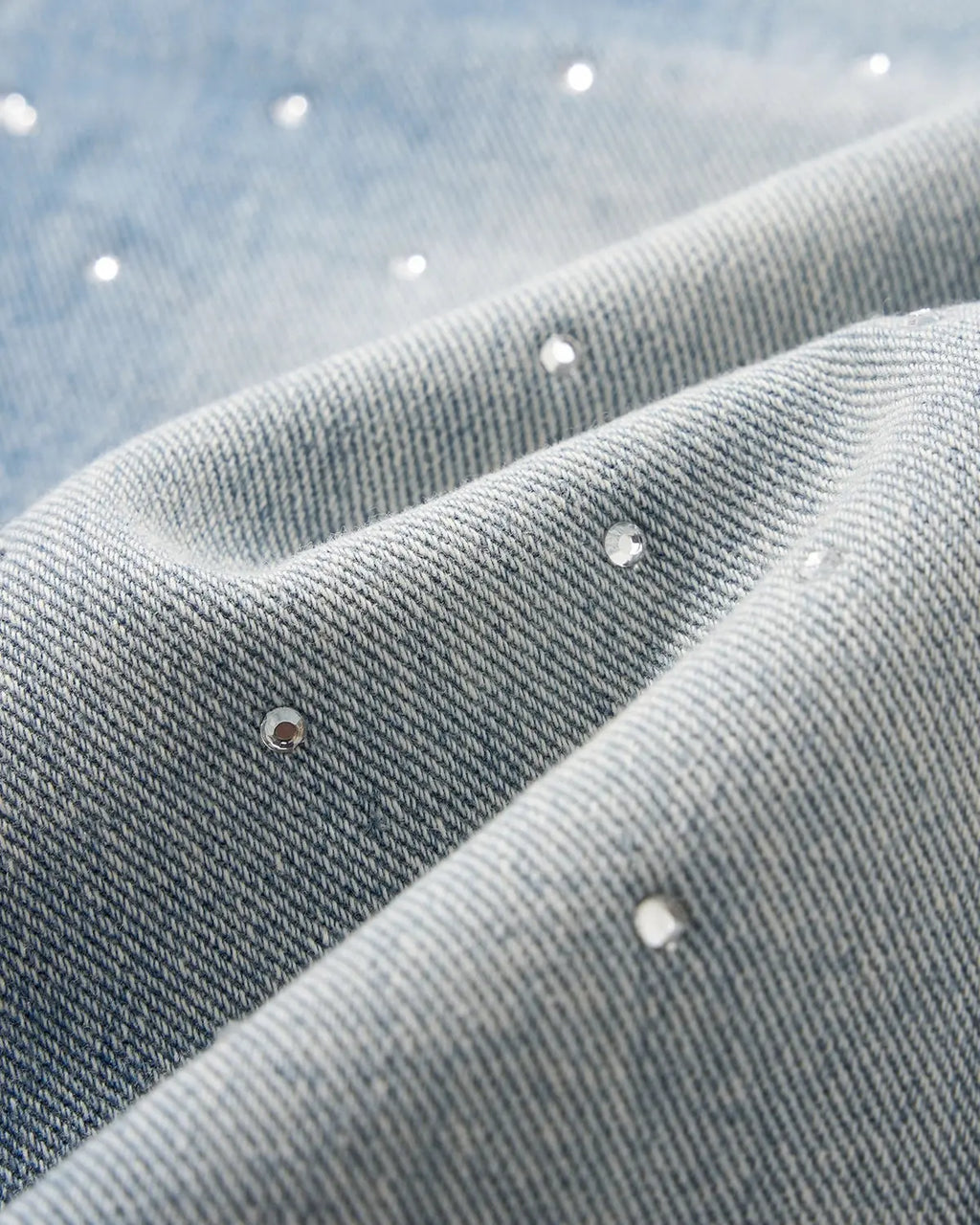 Blue rhinestone baggy jeans shorts by Flation Streetwear, featuring loose fit and rhinestone embellishments, shown on a model.