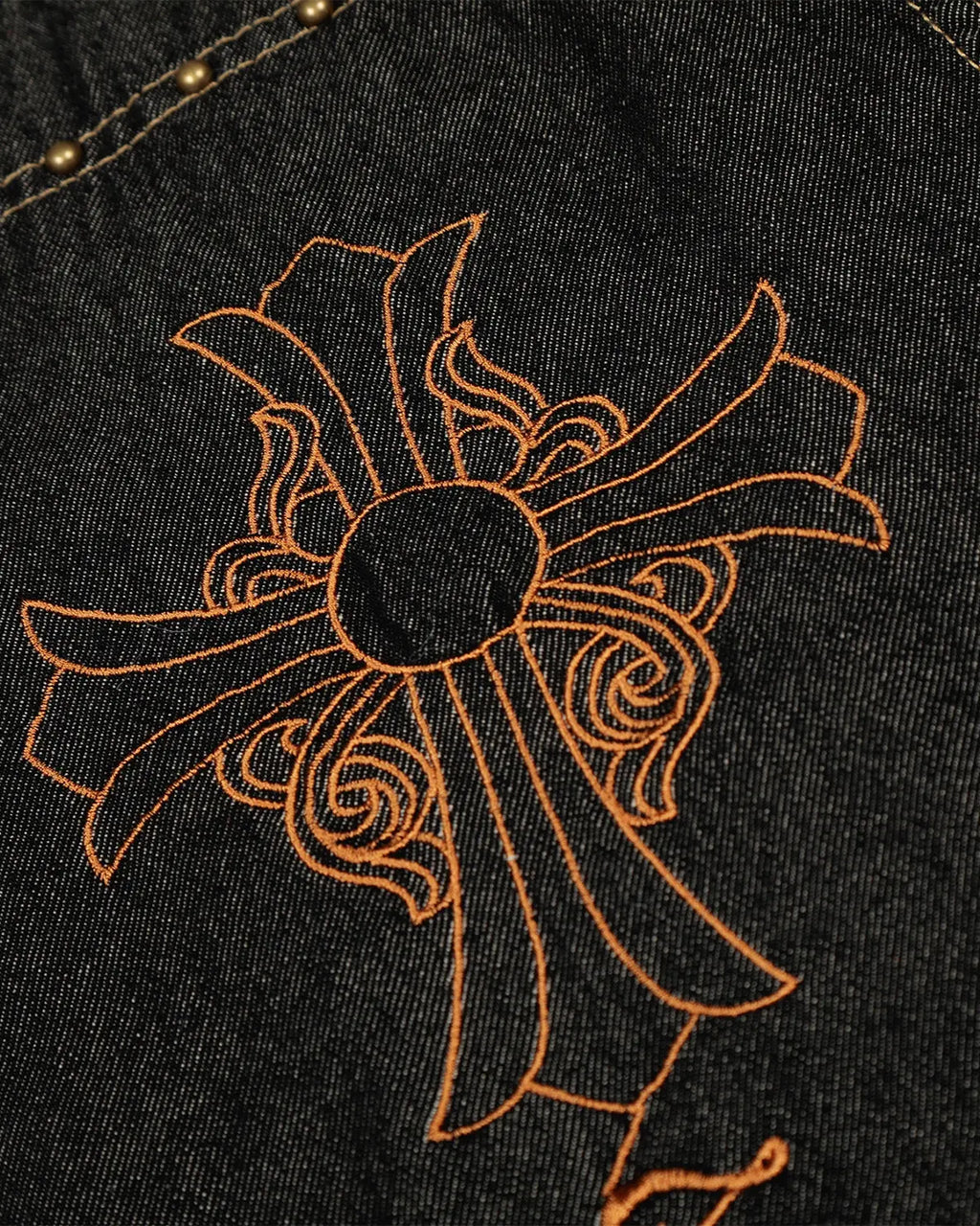 Black barrel jeans with gothic cross embroidery from Inflation Streetwear, featuring distressed details and a relaxed fit.
