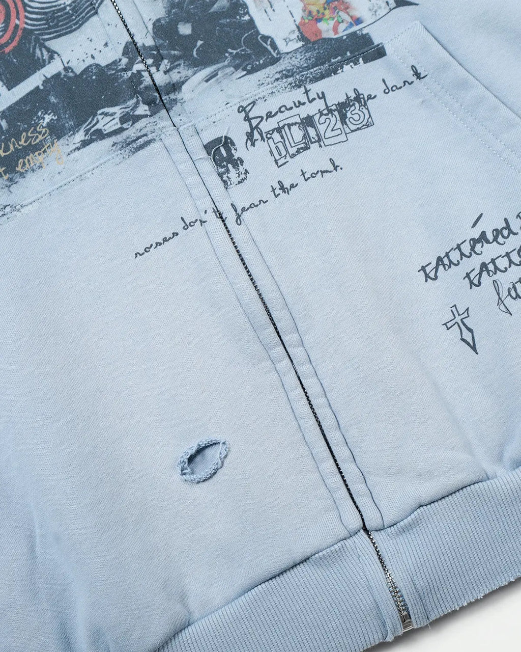 Inflation streetwear graffiti character distressed washed zip hoodie with bold artwork and a relaxed fit, displayed on a hanger.