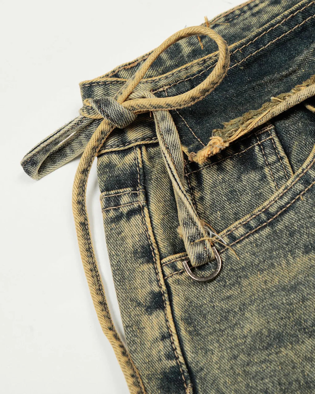 Distressed washed wide-leg denim jeans by INFLATION featuring a relaxed fit and faded, worn-in look on light blue denim fabric.