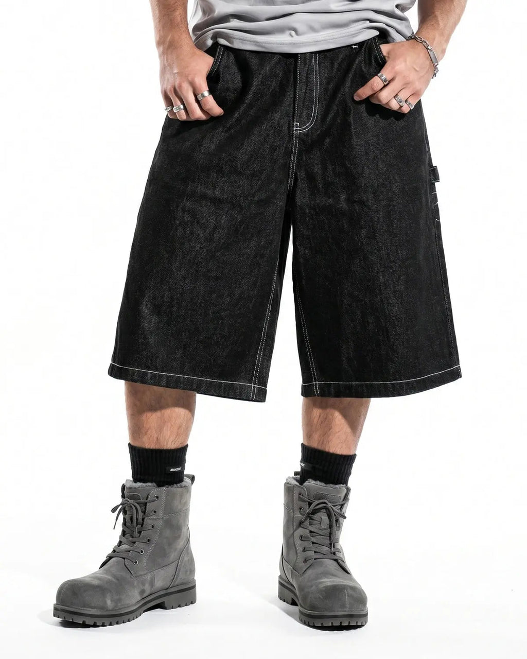 Contrast stitching raw cargo jorts by INFLATION, featuring rugged denim with distressed details and functional pockets.